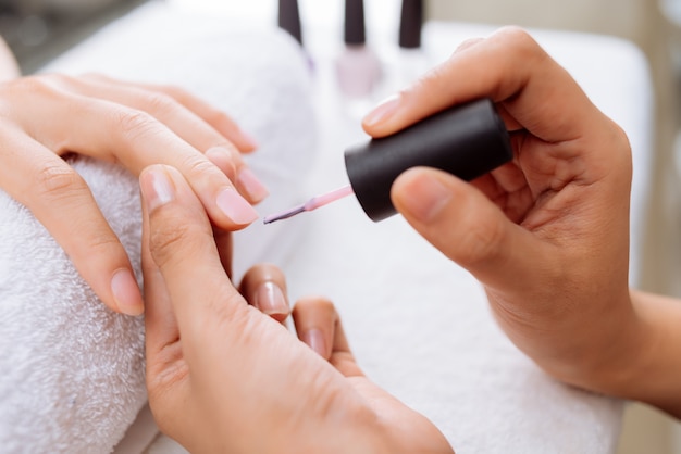 Applying pink polish