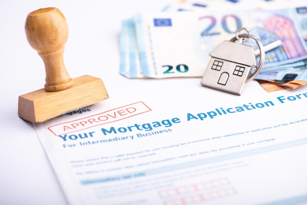 Approved Mortgage loan application with rubber stamp close up