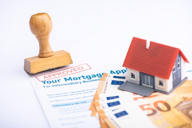 Photo approved mortgage loan application with rubber stamp close up