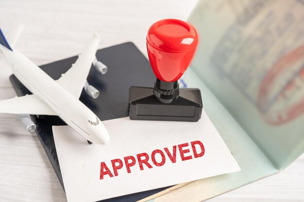 Approved Stamp visa and passport document to immigration at airport in country