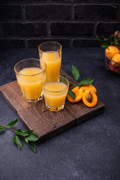 Apricot juice in glass. Healthy drink