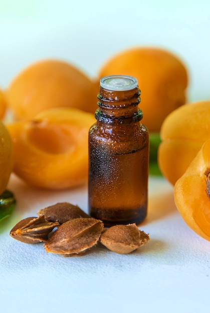 Apricot kernel oil in a bottle. Selective focus. Food.