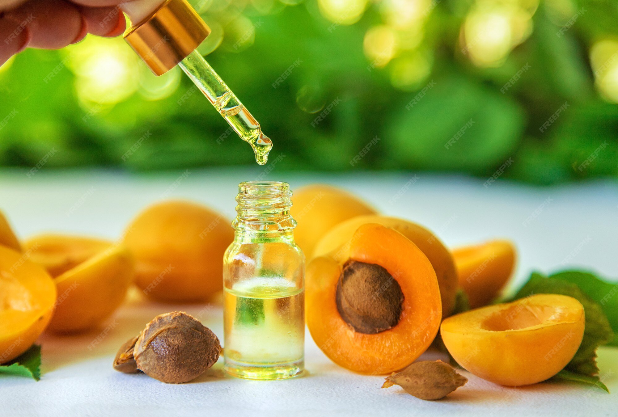 Premium Photo Apricot kernel oil in a bottle. selective focus.