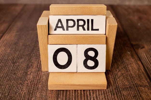 April 08 calendar date text on white wooden block