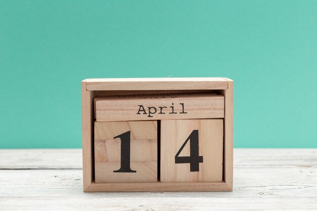 April 14th, Day 14 of april month, wood calendar on table