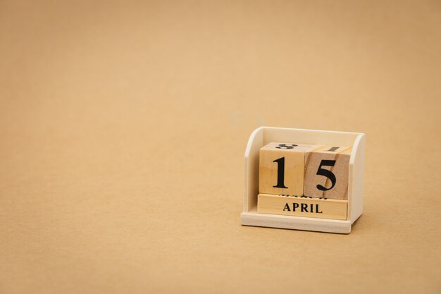 April 15 : wooden calendar on vintage wood abstract background. Health Day 