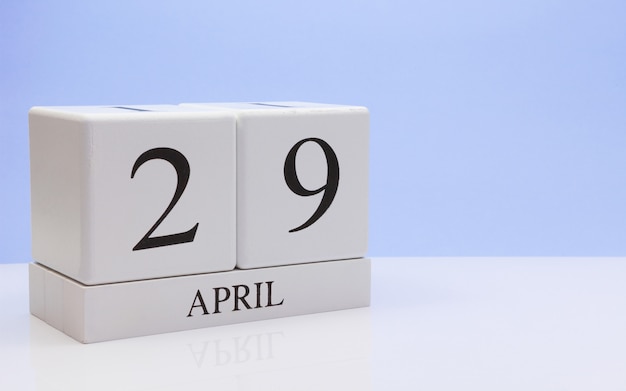 Photo april 29st. day 29 of month, daily calendar on white table with reflection