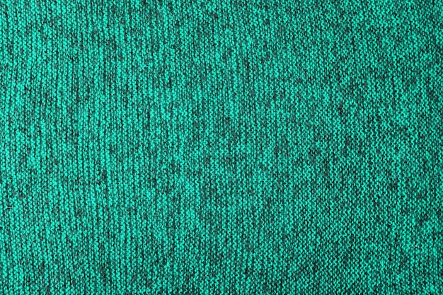 Aqua green and black melange knitted texture and flat\
background