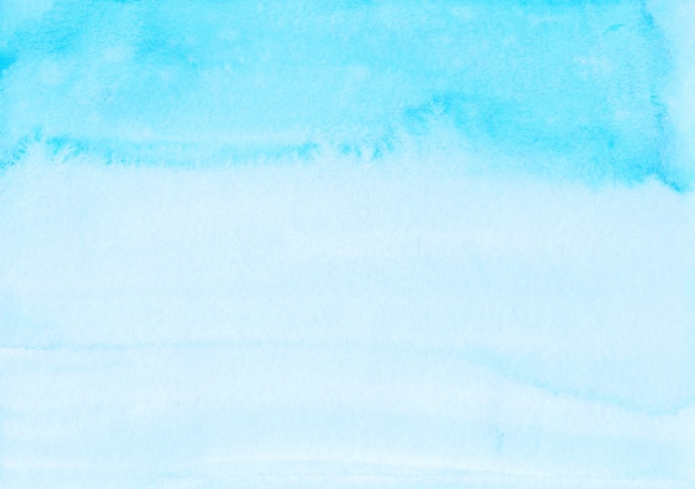 Aquarel lichtblauwe ombre achtergrond hand geschilderd. Aquarelle hemelsblauw textuur.