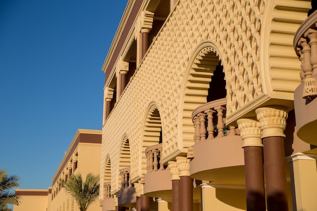 Arab buildings with palm trees in the hotel