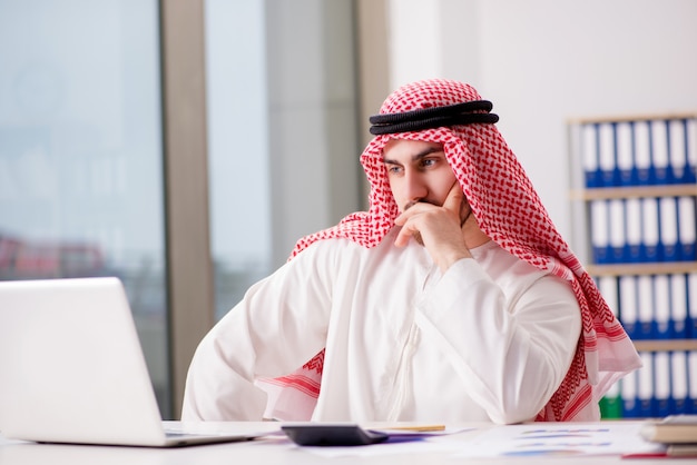 Arab businessman working on laptop computer