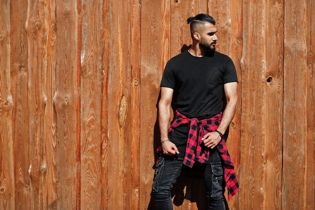 Arab hipster beard man lumberjack against wooden background.