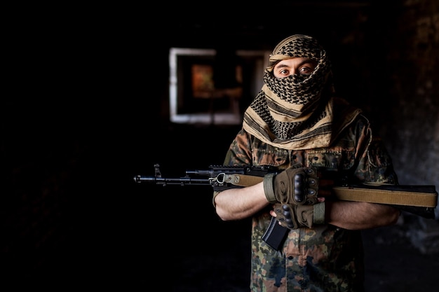 The Arab soldier with the AK-47 Kalashnikov assault rifle