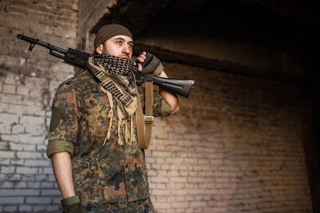 The Arab soldier with the AK-47 Kalashnikov assault rifle