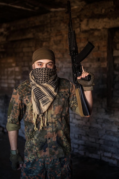 The Arab soldier with the AK-47 Kalashnikov assault rifle