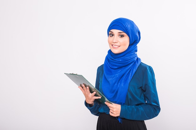 Arab Student holding a folder in studio