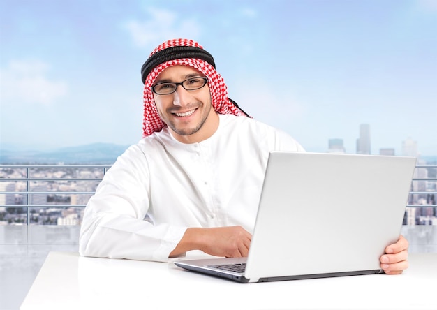 Arabian business man having coffee in his office