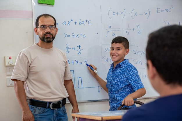 Arabian Children's in school so excited with teacher to answer the teacher questions