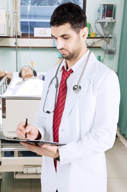 Arabian doctor checking his patient in the hospital