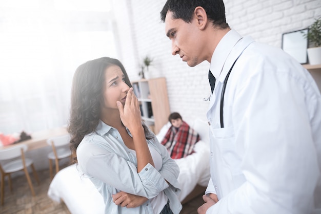 arabian doctor consulting a sick child parent.