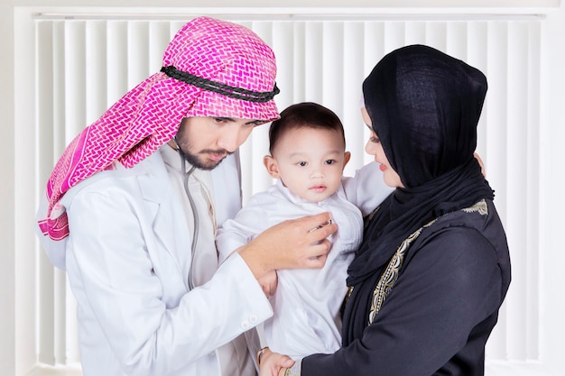 Arabian doctor examining a little boy