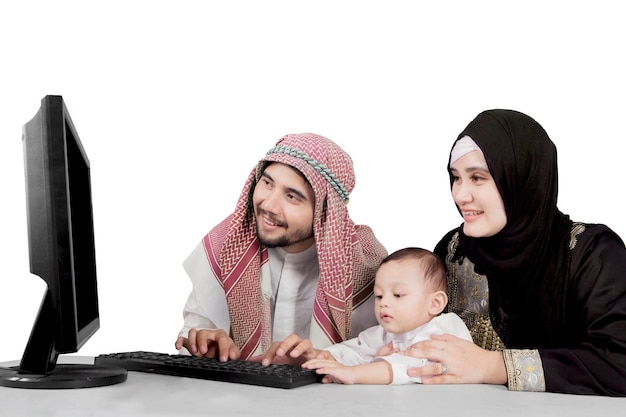 Arabian family using a computer on studio