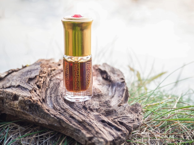 Arabian oud attar perfume or agarwood oil fragrances in mini bottle.