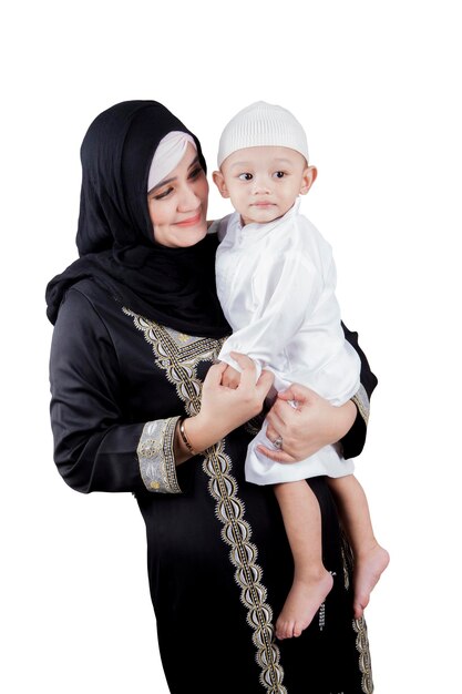 Arabian woman holding her son on studio