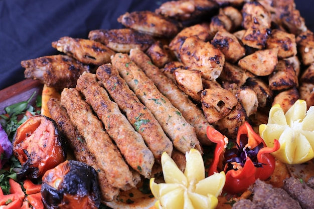 Arabic BBQ Grills AKA Mashawi Garnished with Vegetables Grilled Tomatoes Food Stcok Photos