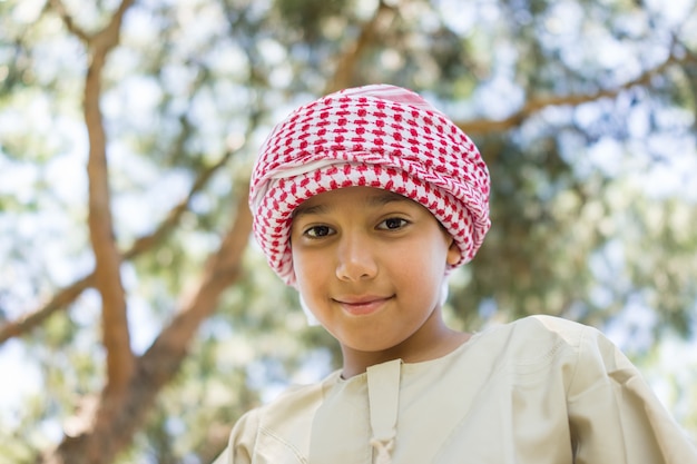 Arabic boy on tree