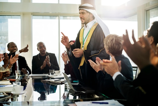 An Arabic Business Man Presenting in a Meeting 