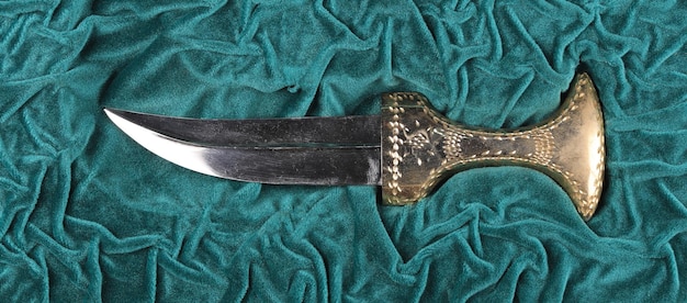 arabic dagger on green velvet