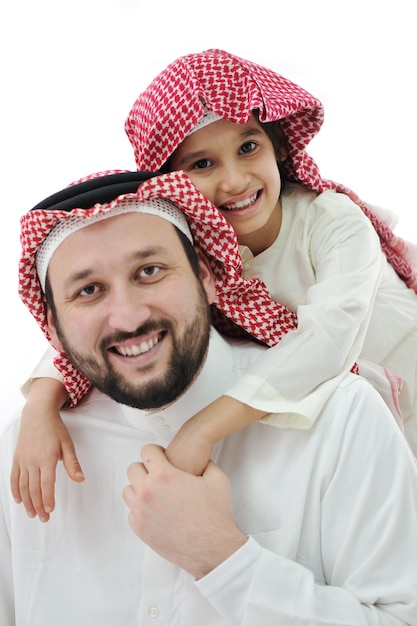 Arabic family, father piggybacking son