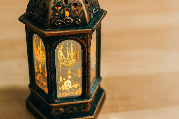 Arabic lantern with burning candle close up