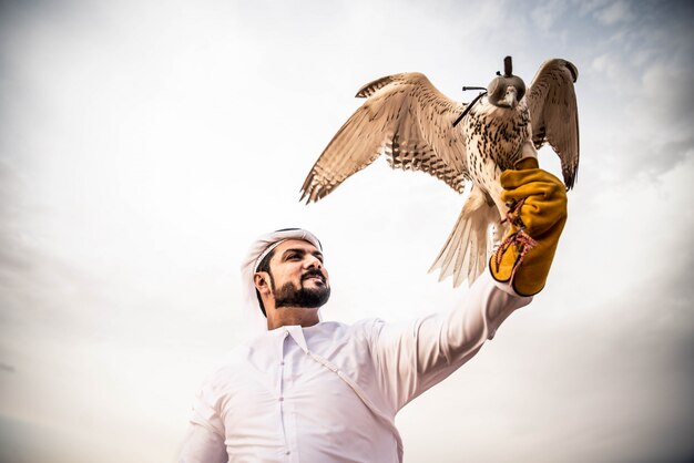 Arabic man in the desert with his hawk