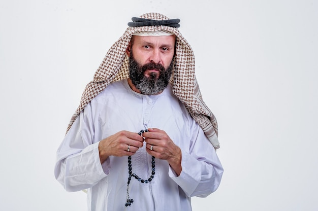 Arabic man posing on white background.