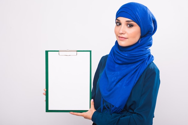 Arabic Muslim beautiful woman holding banner for your text.