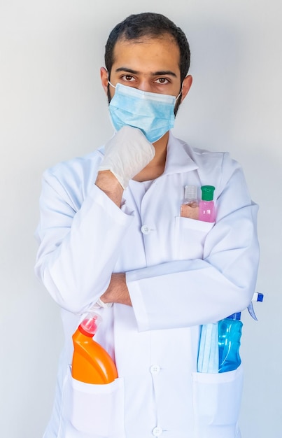 Arabic muslim doctor holding many hygiene products