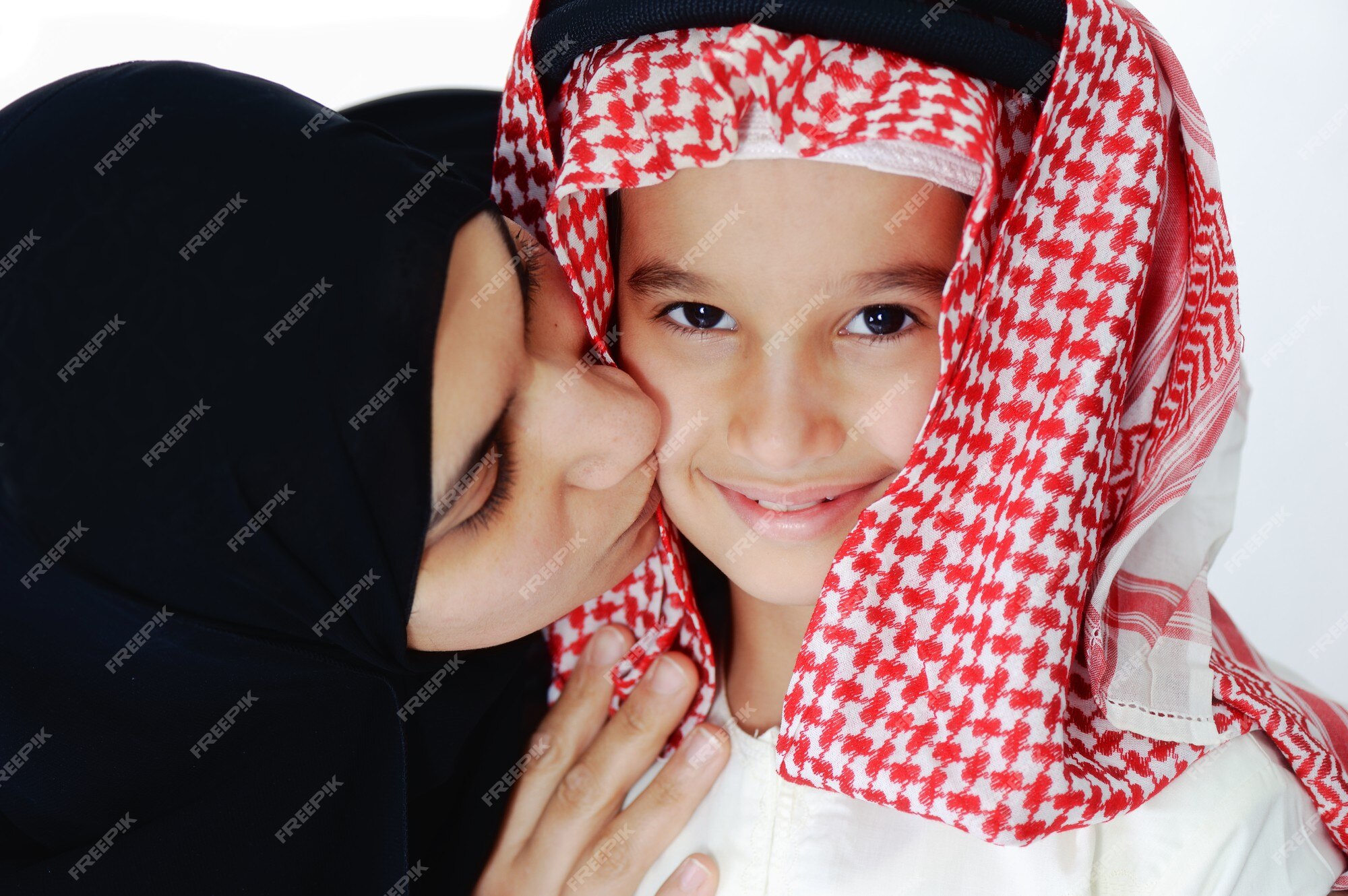 Premium Photo Arabic Muslim Mother Kissing Her Little Son 