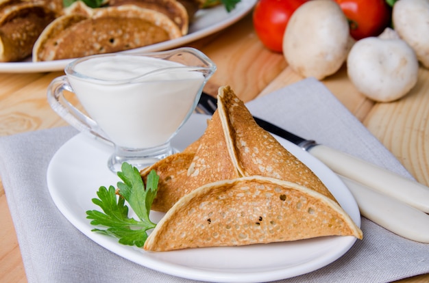 Arabic pancake Qatayef with mushrooms and cheese