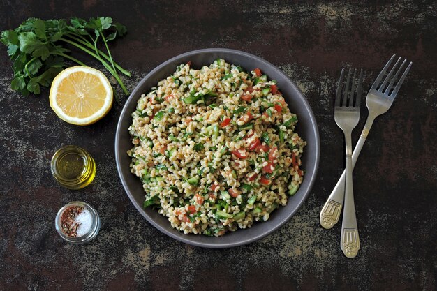 Photo arabic salad tabbouleh in a bowl.