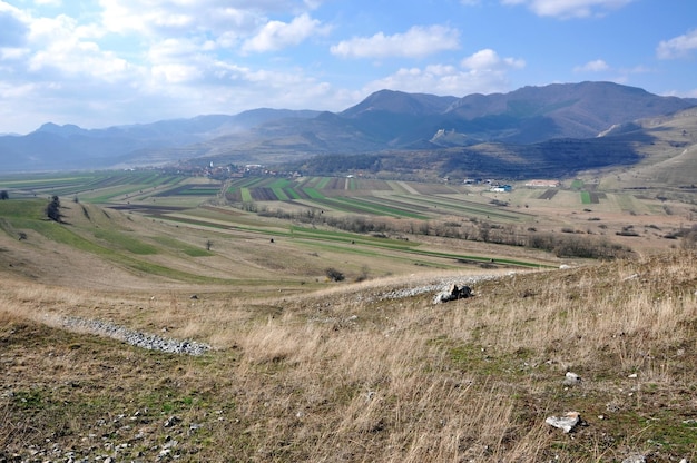 Arable field at spring with a mountain in the back