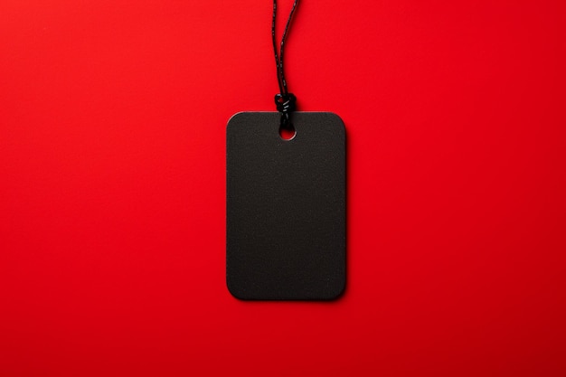 arafed black tag on a red background with a black cord generative ai