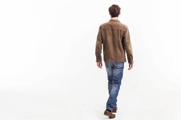 arafed man walking towards the camera with a brown jacket generative ai