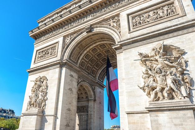 Arc de Triomphe on blue sky in Paris France