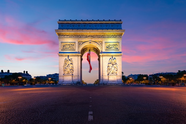 Arc de Triomphe de Paris at night in Paris, France. 