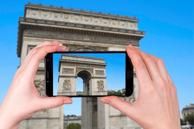 Arc de Triomphe in Paris in France. on the tourist's smartphone