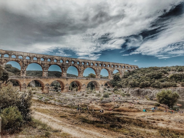 Arch bridge against sky