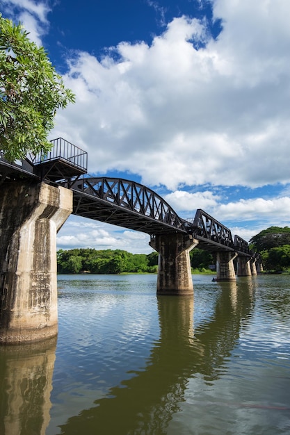 Arch bridge over river against sky