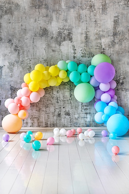 Arch of colored balloons on a holiday. Copy space for text. Vertical photo
